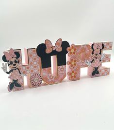 the word hope is made up of wooden letters with minnie mouse characters