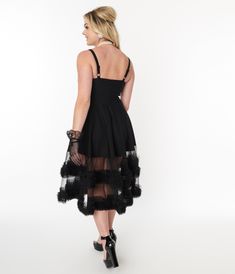 Step into the timeless allure of this classic LBD that'll have you feeling like a true Hollywood starlet! The vintage-style sweetheart neckline, paired with adjustable straps, frames your décolletage with grace and elegance. But hold on tight, darlings, 'cause the full circle mini skirt adorned with an attached boa tulle bottom adds a touch of whimsical charm that'll have you dancing under the moonlit Roman skies. The soft and stretchy bengaline fabric ensures you'll be comfortable as you twirl