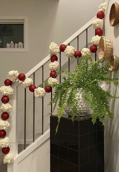 an arrangement of flowers and decorations on the stairs