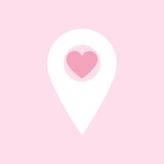 a pink and white map pin with a heart on it