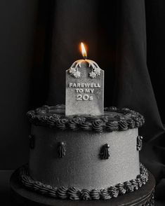 a black and white photo of a birthday cake with a lit candle on top that reads farewell to my 205