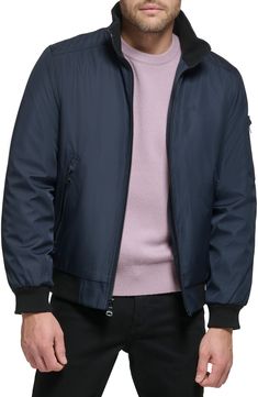 Every closet craves this edgy bomber styled with handy side pockets, a water-resistant finish and comfy ribbed trim. Front zip closure Stand collar Front zip pockets Ribbed cuffs and hem Water resistant Lined 100% polyester Machine wash, line dry Imported Casual Nylon Windbreaker With Zip Fly, Fall Nylon Windbreaker With Ribbed Cuffs, Modern Nylon Outerwear With Ribbed Cuffs, Calvin Klein Casual Outerwear For Cold Weather, Fall Nylon Windbreaker With Zip Fly, Modern Nylon Outerwear With Zipper Closure, Casual Nylon Outerwear With Side Pockets, Casual Calvin Klein Fall Outerwear, Calvin Klein Casual Fall Outerwear