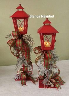 two red lanterns decorated with ribbons and lights