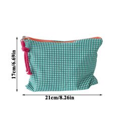 a green and white checkered bag with pink tassels on the front, measurements