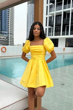 A delicate midi-length dress with the most feminine "godet" silhouette skirt in Yellow. Drapery on the bodice line is designed to ensure your look to be joyful and romantic. The garment has a fitted cut and puffy sleeves. The dress favorably emphasizes the silhouette, tightly fitting the hips, expanding to the bottom. The dress will make you feel the prettiest and good looking ever. Feminine A-line Puff Sleeve Dress For Brunch, A-line Dress With Pleated Sleeves For Brunch, Flirty Fitted A-line Midi Dress, Short Sleeve Dress With Gathered Sleeves, Flirty Dresses With Gathered Short Sleeves, Flirty Short Sleeve Dress With Gathered Sleeves, Cocktail Dress With Square Neck And Pleated Sleeves, Fitted A-line Puff Sleeve Dress, Fitted Square Neck Pleated Midi Dress