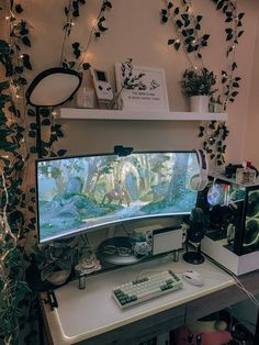 a computer monitor sitting on top of a desk next to a keyboard and mouse in front of a screen