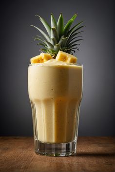 a pineapple and banana smoothie in a glass