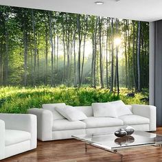 a living room with white furniture and green trees in the backround wall mural