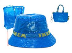 a blue bucket hat with the words tea lake on it and two bags next to it