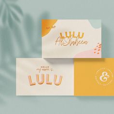 two business cards with the word lulu written in gold foil on top and bottom