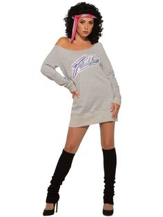 a woman in a grey sweatshirt dress and black thigh high boots posing for the camera