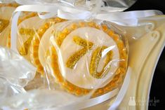 some cookies are wrapped in plastic and have the number seventy on them with gold sequins