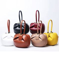 Elevate your look with our Abella French Dumpling Bag. This stylish bag is beautifully crafted out of smooth cowhide genuine leather. It features an elegant top handle and is accented with gleaming gold-tone metal hardware. Abella is a bag you'll use for years to come.Details: Main Material: Genuine LeatherShape: HobosLining Material: PolyesterInterior: No PocketHardness: SOFT Size: Small: (L*W*H) 7.1*3.5*5.5inch Size: Large: (L*W*H) 9.1*3.9*5.9inch Luxury Handheld Bucket Bag For Office, Trendy Handheld Box Bag With Gold-tone Hardware, Handheld Bucket Bag With Gold-tone Hardware For Shopping, Gold Bag With Top And Round Carry Handle, Office Clutch Bag In Soft Leather, Handheld Bucket Bag With Handles For Office, Chic Box Bag With Round Handle, Chic Box Bag With Double Top Carry Handles, Elegant Bucket Bag With Detachable Strap And Top Handle