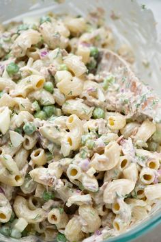 a bowl filled with macaroni salad on top of a table