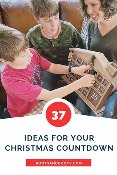 two children and an adult are playing with a wooden christmas decoration box on the couch