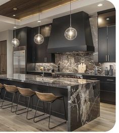 a large kitchen with marble counter tops and black cabinets, along with bar stools