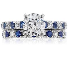 a diamond and blue sapphire wedding set with matching bands on the band, in 18k white gold