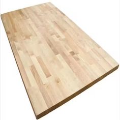 a large wooden cutting board sitting on top of a white surface with no one around it