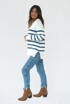 Our Jodi Stripe Sweater has a relaxed fit that exudes sophistication and comfort. Featuring side slits and a slightly dropped shoulder, she pairs perfectly with your favorite bottoms. Jodi is proudly hand-knitted with 100% sustainable cotton yarns by our team of artisans in Bali, supporting heritage techniques. We recommend sizing up for a relaxed, fit. Ethically handknitted by artisans using luxurious sustainable fabrics. 1% of your order funds regenerative carbon offsets How it Fits Product De Sweater Tunic, Eco Friendly Clothing, Different Outfits, Tunic Length, Tunic Sweater, Sustainable Fabrics, Sustainable Clothing, Cotton Sweater, Stripe Sweater