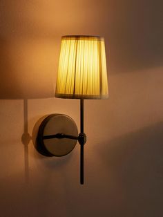 a lamp that is on the side of a wall