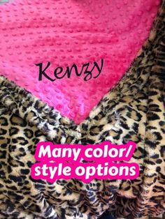 a leopard print blanket with pink and black polka dots on it, next to the words kenya