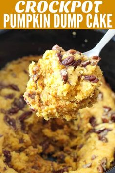 crockpot pumpkin dump cake in a skillet with a spoon full of pudding