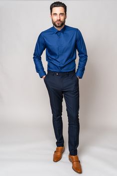 Look effortlessly smart for all every occasion in this blue Carter shirt. This wardrobe staple is cut to a classic fit with long sleeves and spread collar. Keep it formal by wearing alongside your three piece suit, or make it casual by rolling up the sleeves and paring with chinos or jeans. Model wears size M shirt and the Max navy trousers. Features Classic fit Spread collar Single cuff Long sleeve Plain fabric Cufflink holes Style Tip | ﻿Wear with a style that has navy detailing like the Scott Slim Fit Cotton Shirt With Lapel Collar For Office, Slim Fit Shirt With Lapel Collar For Office, Slim Fit Office Shirt With Lapel Collar, Blue Long Sleeve Dress Shirt For Business Casual, Blue Long Sleeve Business Casual Dress Shirt, Smart Solid Color Office Shirt, Smart Office Shirt, Slim Fit Dress Shirt With Lapel Collar For Office, Slim Fit Shirt With Welt Pockets For Business Casual