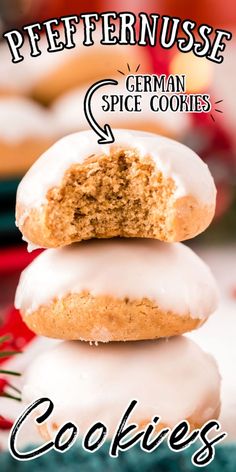 a stack of cookies with white frosting and cinnamon sprinkles