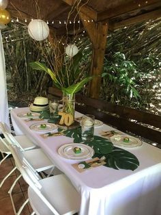 a table set up with plates and place settings for two people to sit down at