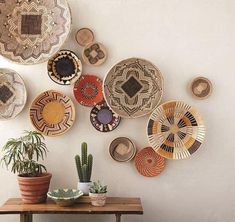 a table with some plants and baskets on it