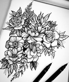 black and white drawing of flowers with two pens on the table next to it,