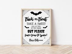 a framed halloween print with the words trick or treat, take a sweet one if you dare but please leave your spooky spider