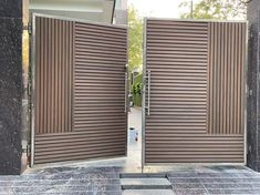 an open wooden door on the side of a building