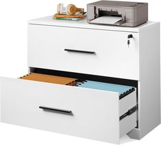 a white filing cabinet with two drawers and a printer on top