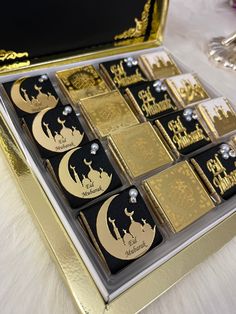 a box filled with lots of gold colored lighters