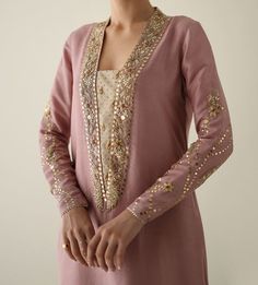 Product Description:  Presenting our long shirt made of pure raw silk in a coral blush color--a subtle yet elegant vision. This blouse, has tiki stones, crystals, dabka, naqshi, and Kamdani handwork embellishing the sleeves and collar. This ensemble is the pinnacle of sophistication and elegance, paired with an organza dupatta with sequence edging and a hizar embellished with intricate sequence stitching. Color: Coral Can be customized in any color Includes:  Shirt Pants Duppata Novel Books, Painting Scenery, Books Wedding, Shorts Crochet, Aesthetic Shorts, Coral Blush, Music Painting, Silk Outfit, Suits Design