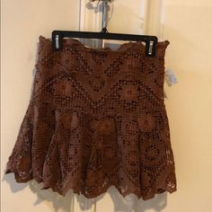 Originally Purchased For Beach But Never Worn, This Is A Pretty Floral Cotton Crocheted Overlay Attached Over A Solid Brown Skirt. Label Says 100% Cotton But Underskirt Definitely Has Stretch And Waist Is Elastic. Side Zipper. Casual Lace Skirt For Beach, Bohemian Lace Mini Skirt For Summer, Brown Bohemian Mini Skirt For Summer, Bohemian Brown Mini Skirt For Summer, Bohemian Brown Mini Skirt For Spring, Brown Mini Skirt For Beach In Spring, Brown Mini Skirt For Spring Beach Outing, Fitted Brown Mini Skirt For Beach, Fitted Brown Mini Skirt For The Beach