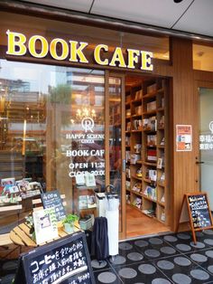 the book cafe is open and ready for customers to use it's doors as their menus