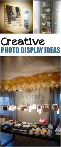 a table topped with lots of food and balloons hanging from it's ceiling above