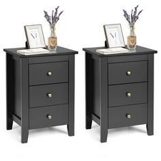 two nightstands with flowers and pictures on them, one has a clock in the middle