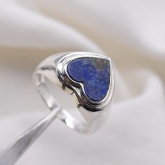 Blue Lapis Lazuli 925 Sterling Silver Gemstone Ring Jewelry ~ September Month Birthstone ~ Heart Shape Ring ~ Gift For Valentine Day weight- 4.5 Gram The Ring is stamped 925. We guarantee the quality and the genuine properties of silver and the stone.  About Lapis Lazuli- Encourages self-awareness, allows self-expression and reveals inner truth, providing qualities of honesty, compassion and morality to the personality. Stimulates objectivity, clarity and encourages creativity. Lapis Lazuli assists to confront and speak one's truth and inspires confidence. Delivery-  Delivery ( IMPORTANT PLEASE READ)  Our Aim is to dispatch the parcel in 1 business working day.  FOR UK DELIVERY -  Standard Shipping £3.20- 1st class Non Tracked (1-2 business days)  Tracked 1st Class £4.50   - 1st class Trac Lapis Lazuli Signet Ring With Gemstone For Gift, Sterling Silver Signet Ring With Sapphire For Gift, Sapphire Sterling Silver Signet Ring As Gift, Sapphire Signet Ring In Sterling Silver As Gift, Sterling Silver Sapphire Signet Ring For Anniversary, Sapphire Sterling Silver Signet Ring For Anniversary, Sapphire Signet Ring In Sterling Silver For Anniversary, Heart Shaped Sterling Silver Blue Rings, Blue Heart-shaped Sterling Silver Rings