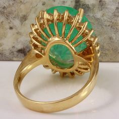 13.00 Carats Natural Emerald and Diamond 14K Solid Yellow Gold Ring Suggested Replacement Value: $13,000.00 Total Natural Green Emerald Weight is: 12.00 Carats (transparent) Emerald Measures: 16.27 x 14.42mm Natural Round Diamonds Weight: 1.00 Carats (color G / Clarity VS2-SI1) Ring total weight: 8.8 grams Disclaimer: all weights, measurements and colors are approximate and may vary slightly from the listed dimensions or as seen in the image. All pictures are magnified to show the smallest of de Green Oval Diamond Ring Collectible, Formal 14k Stamped Halo Ring, Green Diamond Collectible Ring, Formal Round Emerald Ring With Prong Setting, Round Emerald Ring With Prong Setting For Formal Occasions, Collectible Green Diamond Ring, Yellow Gold Emerald Pear-shaped Ring For Anniversary, Stamped 14k Gold Halo Ring For Formal Occasions, Gia Certified Round Emerald Ring For Formal Occasions