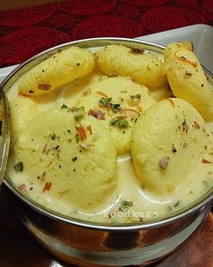 some food is in a metal bowl on a table