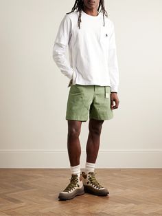 Sacai's second capsule with Carhartt WIP highlights the workwear label's expertise with fabric, fit and construction. Modelled after utility styles, these wide-leg shorts have been made in Japan from hard-wearing cotton-canvas, reinforced with brass rivets and fitted with an adjustable two-tone belt. Workwear Cargo Shorts With Belt Loops, Relaxed Fit Streetwear Shorts With Belt Loops, Green Streetwear Shorts With Belt Loops, Streetwear Cotton Shorts With Belt Loops, Sacai X Carhartt, Casual Shorts For Men, Suede Shorts, Leg Belt, Dad Fashion