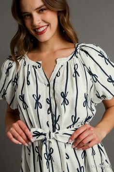 our fluttering bows button down dress is a whimsical blend of playful prints and feminine details that's sure to make a statement. featuring a charming bow print in contrasting tones, it exudes a sense of fun and flair. the fluttering puff sleeves add a touch of romance, while the button-down front and belt front tie create a flattering silhouette. lined for comfort and coverage, this dress is perfect for any occasion, from brunch with friends to a romantic evening out. fabric contents & fit not Bow Print, Flutter Dress, Belt Tie, Cropped Flare Jeans, Dress With Belt, Cropped Flares, Collar Top, Button Down Dress, Midi Maxi Dress