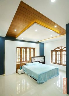 a bed sitting in the middle of a bedroom next to two windows and a wooden ceiling