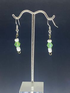 Light green pearl with white beads dangling  Earrings Green Dangle Pearl Earrings, Green Pearl Dangle Earrings, Jade Beaded Drop Earrings, Green Pearl Dangle Jewelry, Green Pearl Drop Earrings As Gift, White Pearl Crystal Earrings, Green Pearl Drop Earrings For Gift, White Pearl Crystal Earrings For Pierced Ears, Elegant Green Beaded Drop Earrings