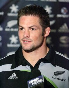 the rugby player is speaking to the media