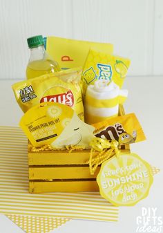 a yellow box filled with snacks and drinks