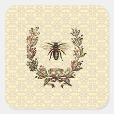 a bee sitting on top of a floral wreath